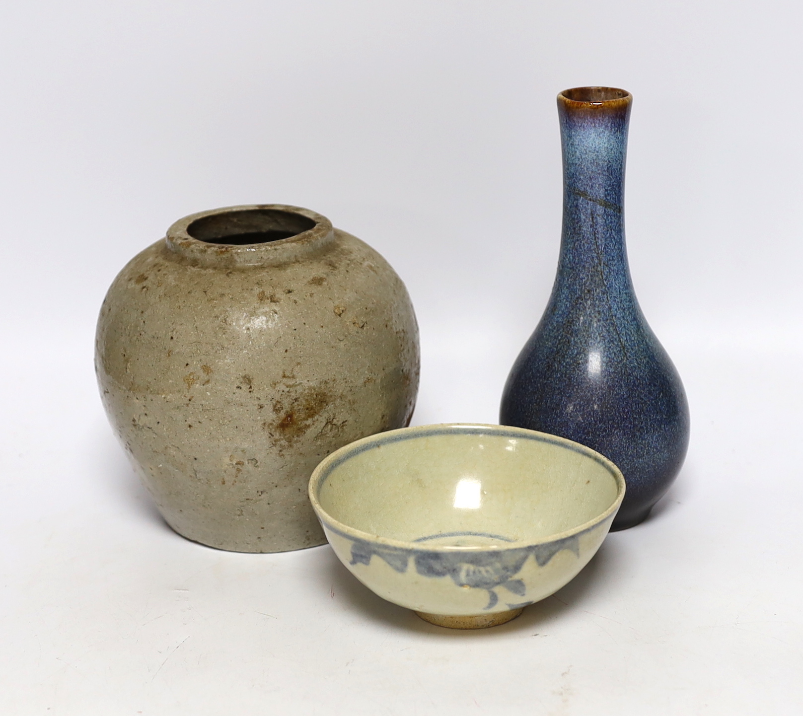 A Chinese Shiwan vase, a jar and a blue and white bowl, largest 18cm high